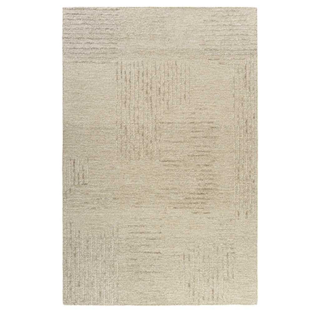 Hand-tufted rectangular haze rug in oatmeal color with a textured abstract geometric pattern.