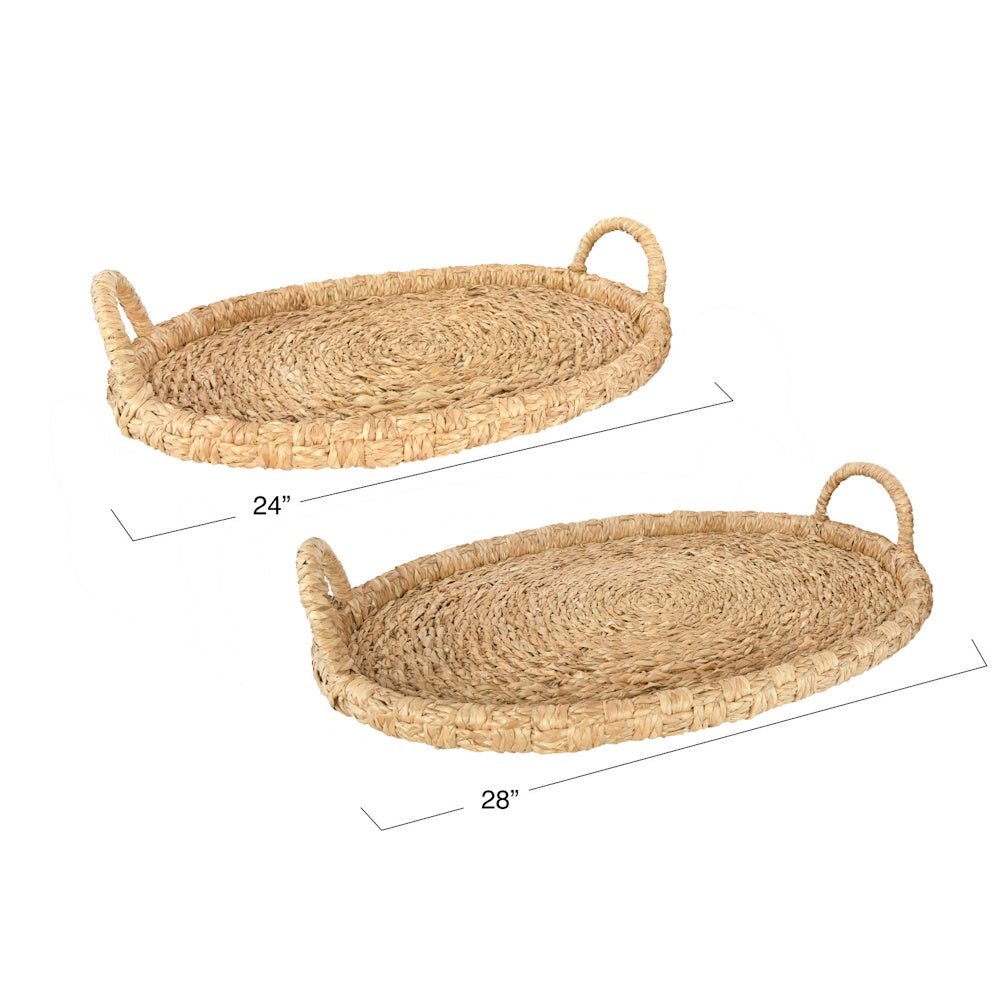 Two oval woven seagrass trays with handles, displaying dimensions of 24 inches and 28 inches.