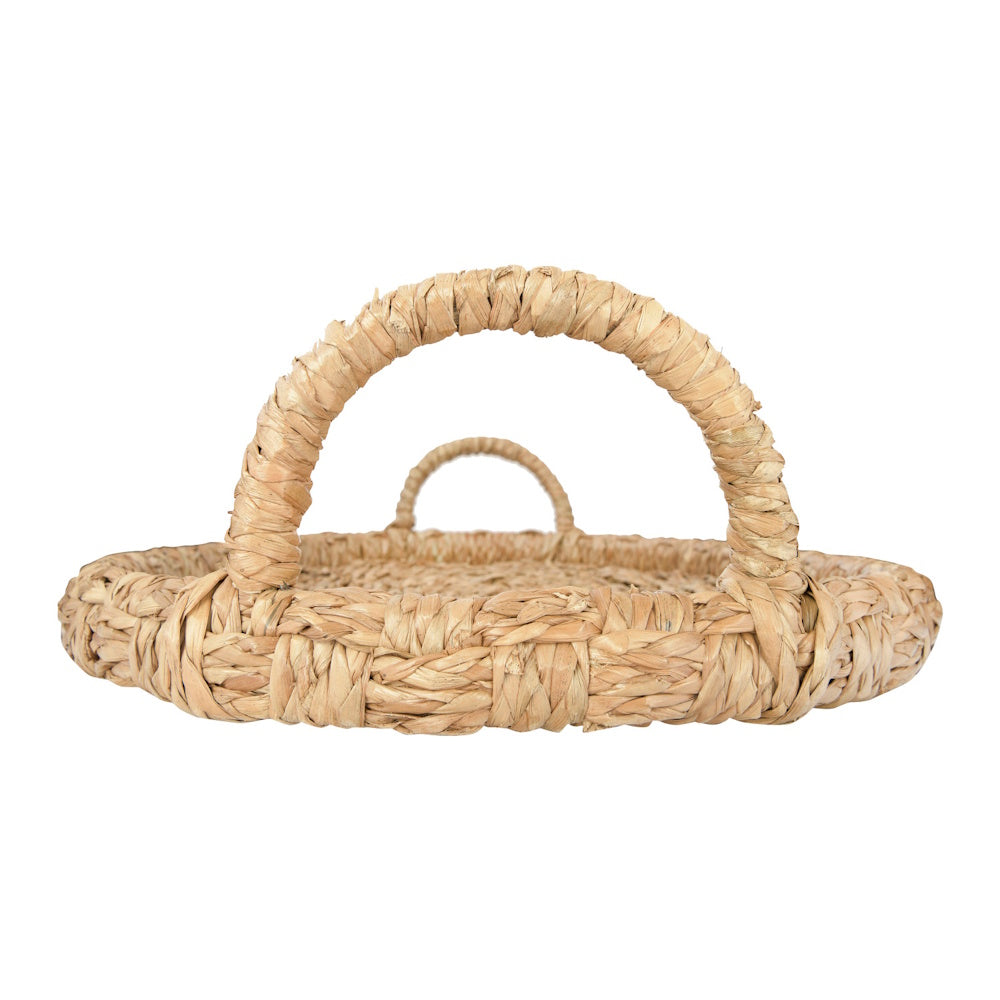 Side view of a round woven wicker tray with two curved handles on a white background.
