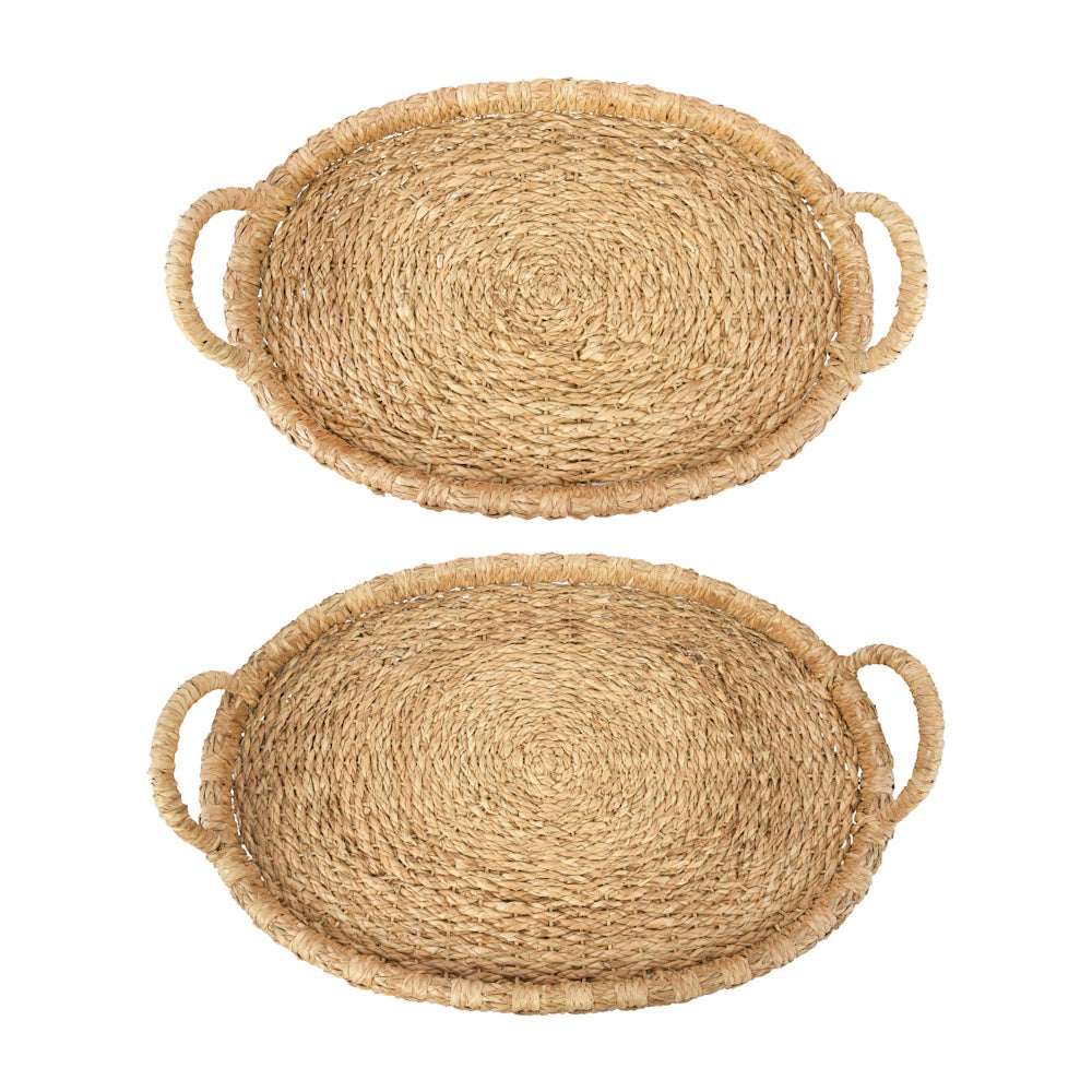 Two oval woven seagrass trays with handles, stacked vertically on a white background.