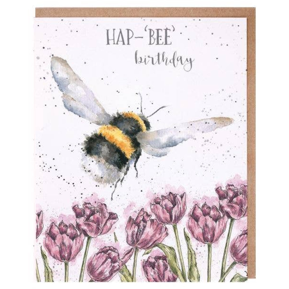 Watercolor bumblebee flying over purple tulips with "Hap-'Bee' Birthday" text on a white greeting card.