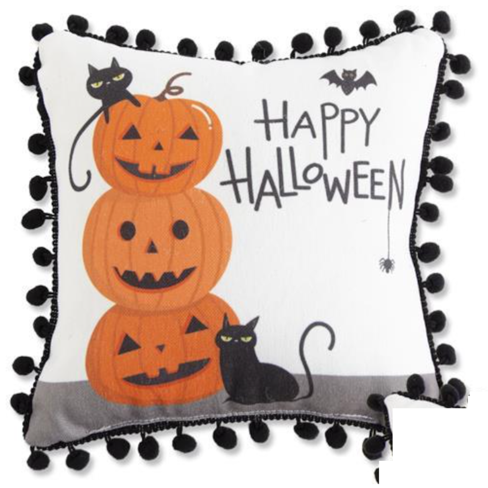 A white Halloween pillow with a black pom-pom border, stacked jack-o'-lanterns, black cats, and text.