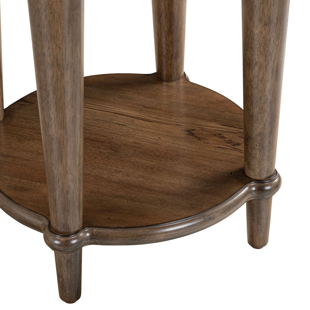 Round wooden chairside table base with four tapered legs and a lower display shelf in a warm brown finish.