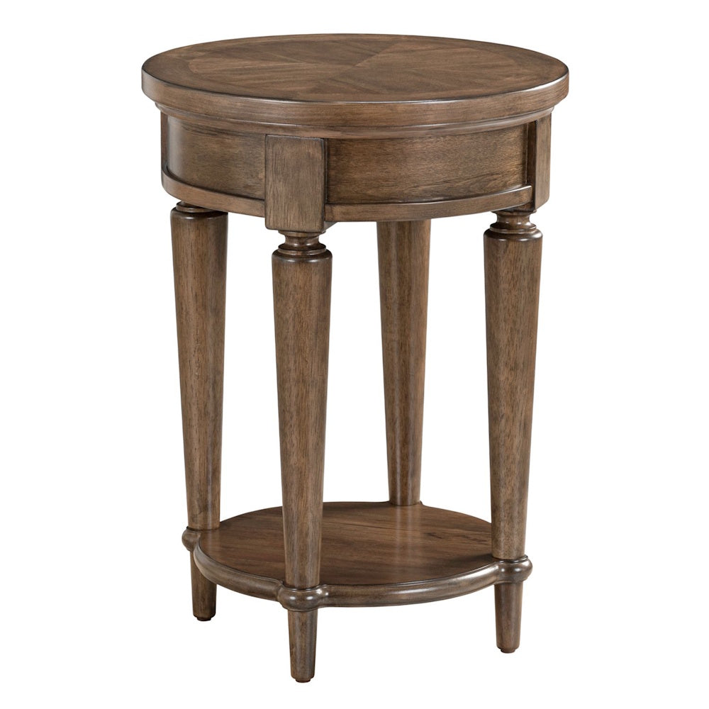 Round wooden chairside table with a warm brown finish, four tapered legs, and a lower display shelf.
