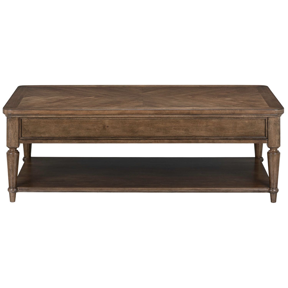 Traditional wood cocktail table with a patterned veneer top, turned legs, and a spacious lower storage shelf.