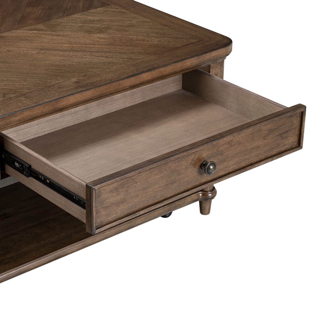 Wooden cocktail table with an open drawer showing side metal glides and a round metal knob.
