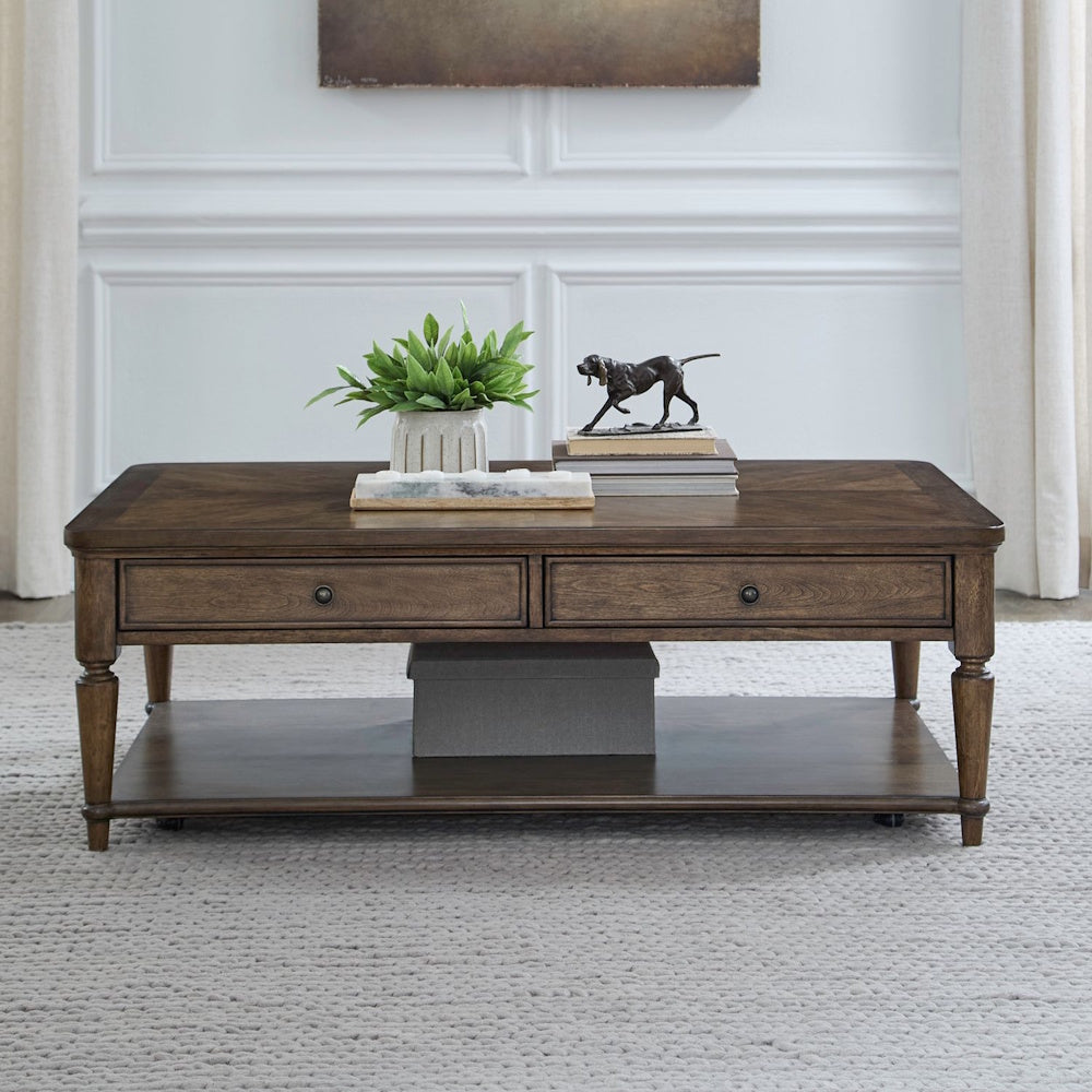 Wooden cocktail table with drawers and a bottom shelf styled in a bright living room.