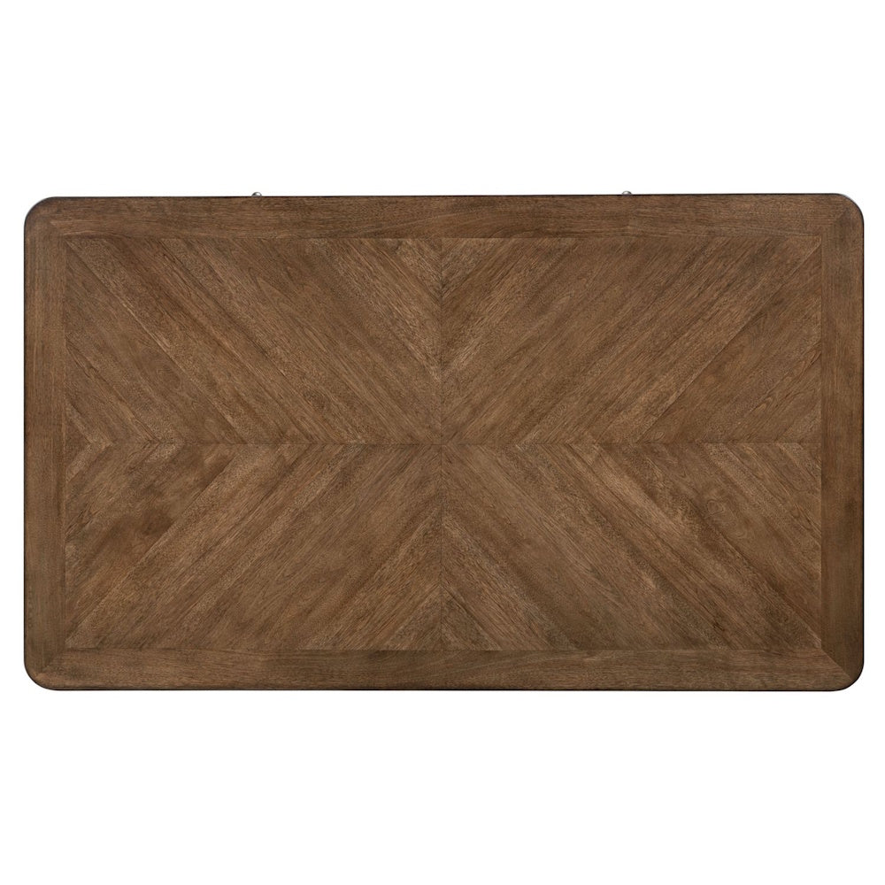 Top down view of a brown wooden cocktail table tabletop showcasing a decorative diamond pattern veneer.