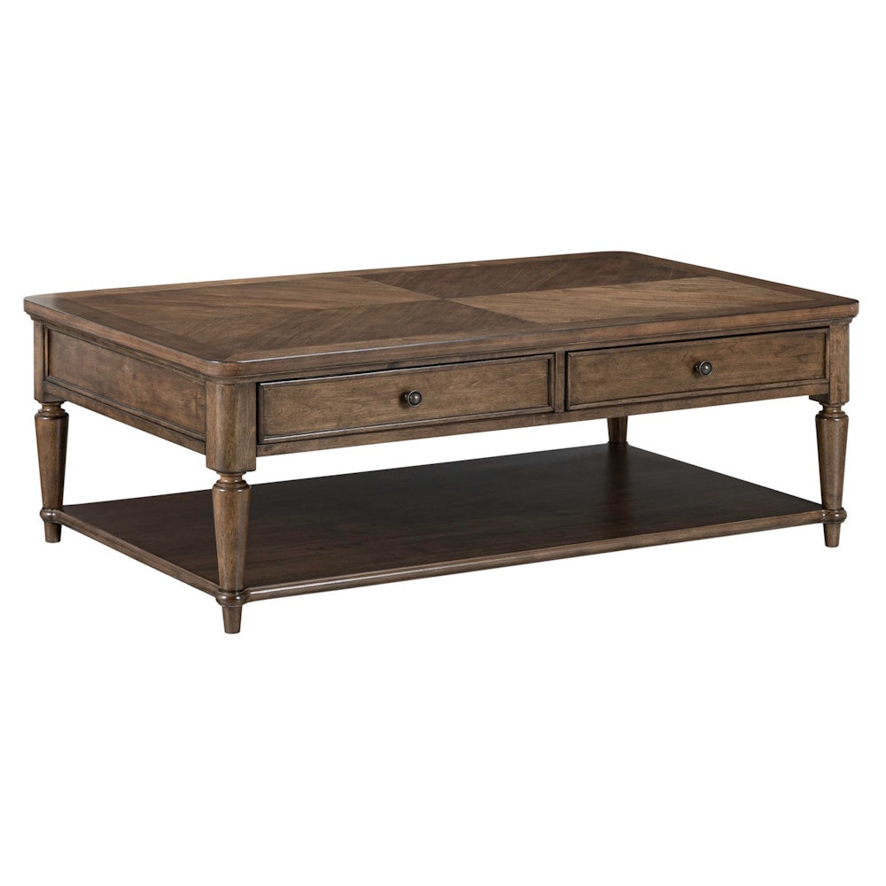 Wooden coffee table with a parquet top, two drawers, turned legs, and a bottom shelf in a brown finish.