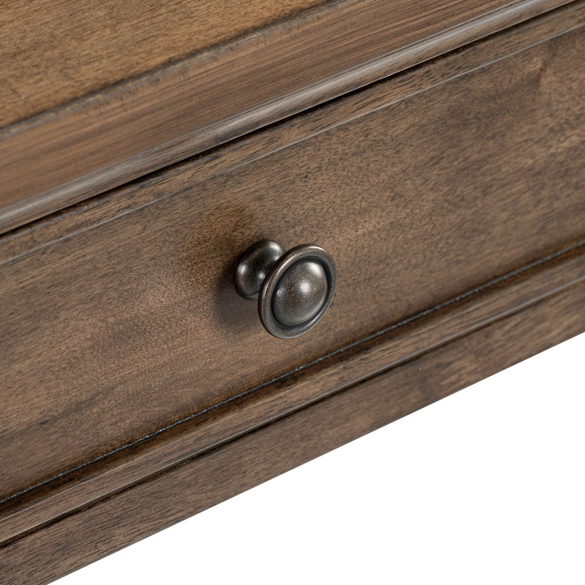 Close-up of the antique bronze metal knob on the wood drawer front of the Harrison Heights end table.