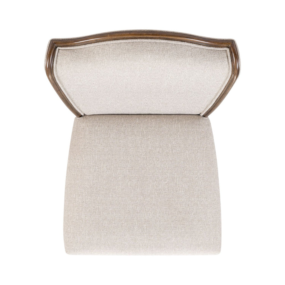 Top view of a Harrison Heights upholstered side chair showing the tan fabric seat and curved wood-trimmed backrest.