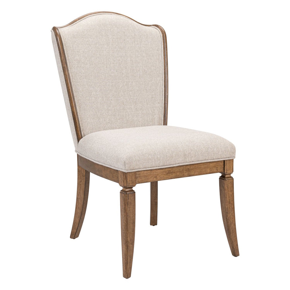 Upholstered side chair with a curved camelback, beige fabric, and tapered wooden legs for traditional dining room decor.