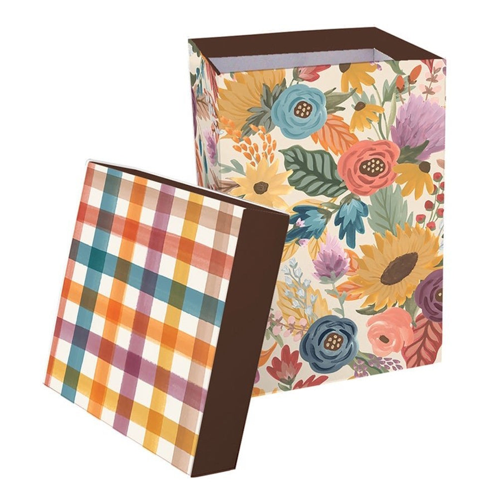 A colorful floral gift box with a matching plaid lid set against a plain white background.