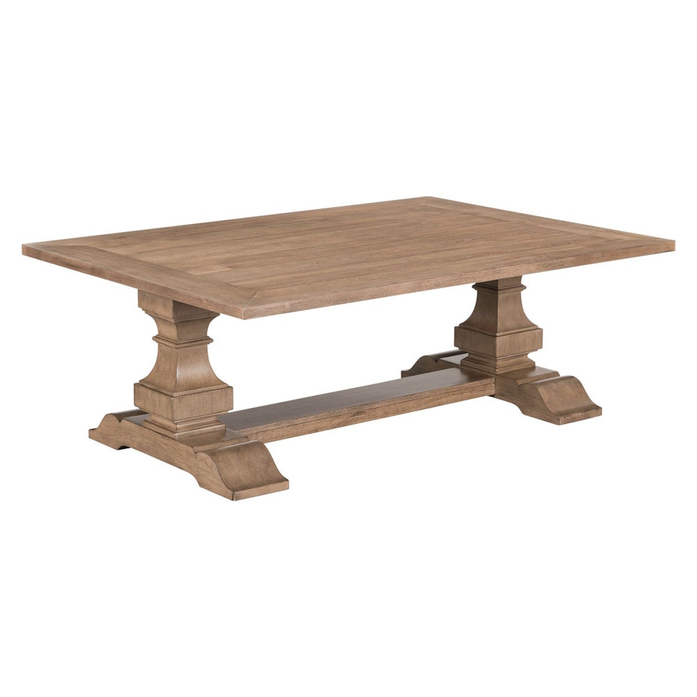 Rectangular wood cocktail table with double pedestal base and natural grain finish.