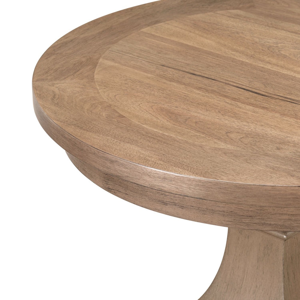 Close-up of round wooden tabletop with natural grain and light brown finish.