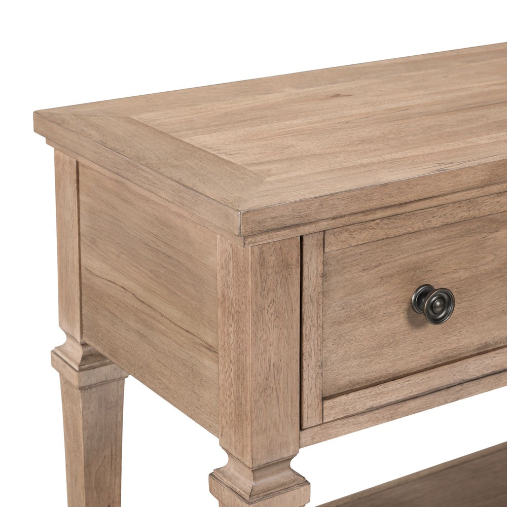 Close-up of light wood sofa table corner with drawer detail and farmhouse style finish.