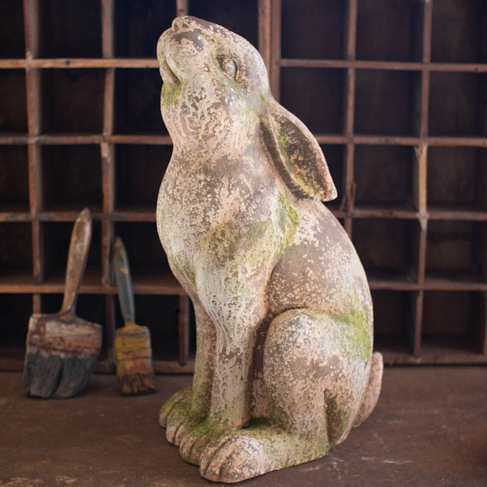 Rustic faux concrete rabbit garden statue with weathered moss finish and vintage distressed texture.
