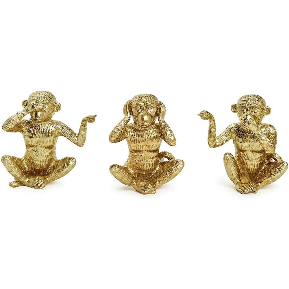 Three gold monkey figurines depicting see no evil, hear no evil, and speak no evil.