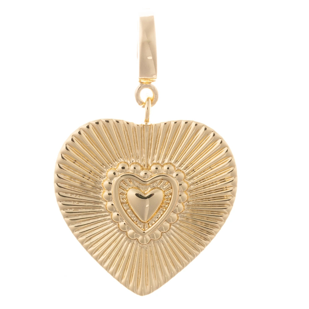 Gold heart charm with a sunburst textured pattern and layered central heart, on a plain white background.