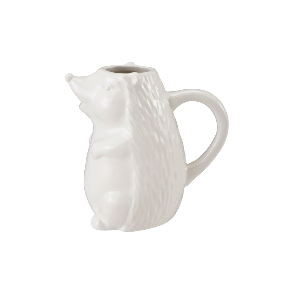 White ceramic hedgehog creamer pitcher featuring a textured back and a convenient curved side handle.