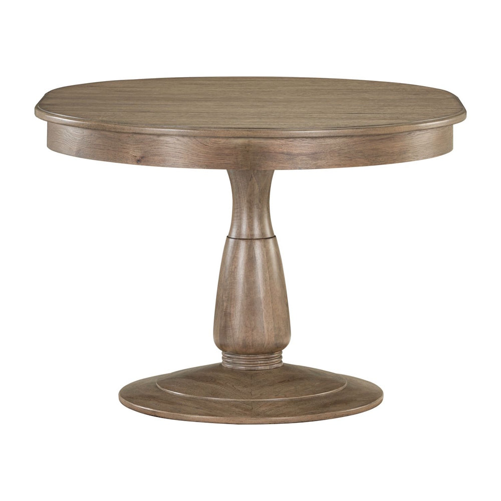 Round wooden pedestal dining table in a natural hickory brown finish isolated on a white background.