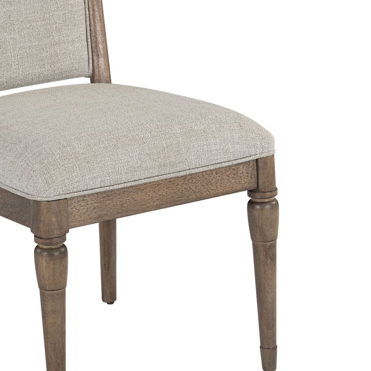 Upholstered dining chair with beige fabric seat and turned wooden legs in a rustic brown finish.