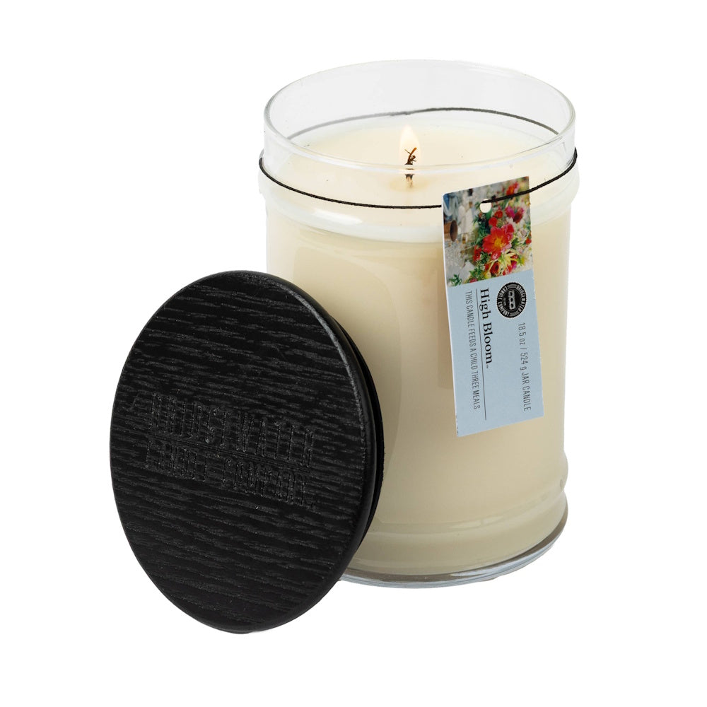 Bridgewater Candle Company High Bloom 18.5 oz jar candle with black lid; charity candle feeds a child three meals.