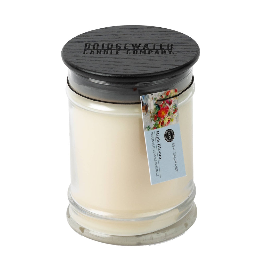 Bridgewater Candle Company High Bloom 8.8 oz jar candle with a black wooden lid and floral product tag.