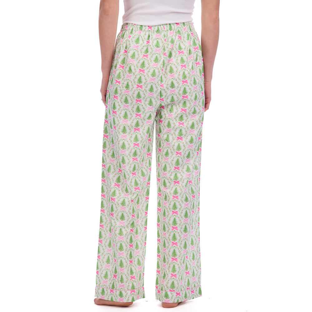 White pajama pants with a festive pattern of green Christmas trees and pink bows.