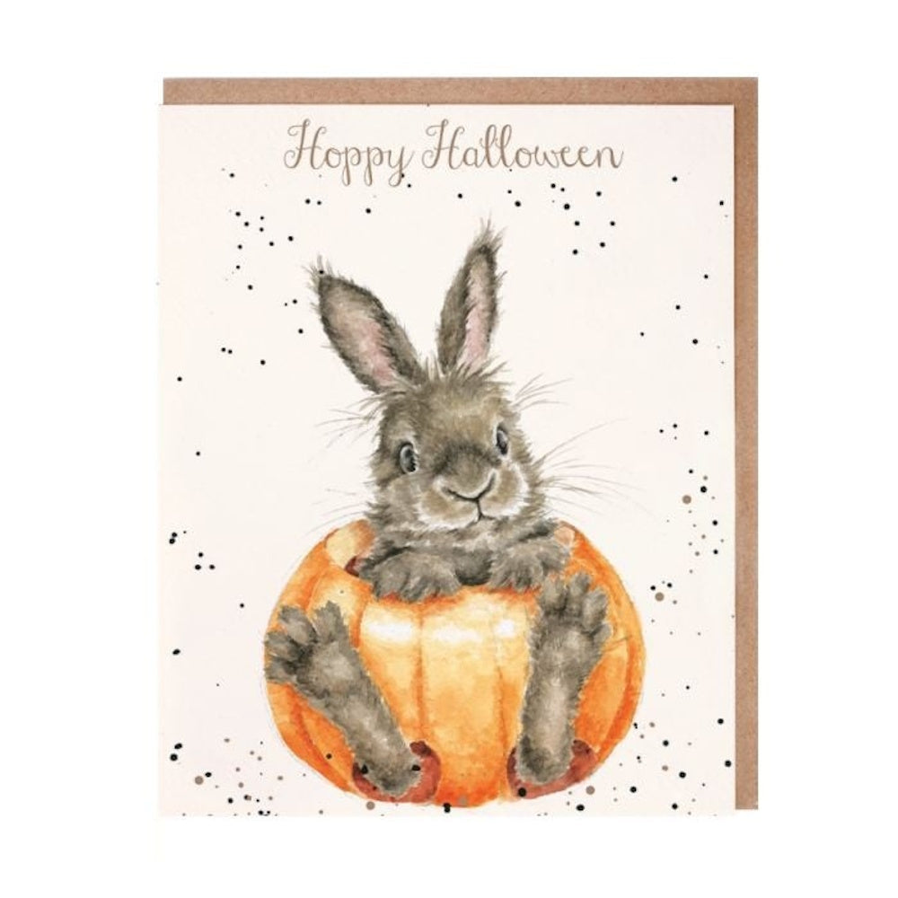 Watercolor Halloween card with a bunny sitting inside a pumpkin under the text "Hoppy Halloween."