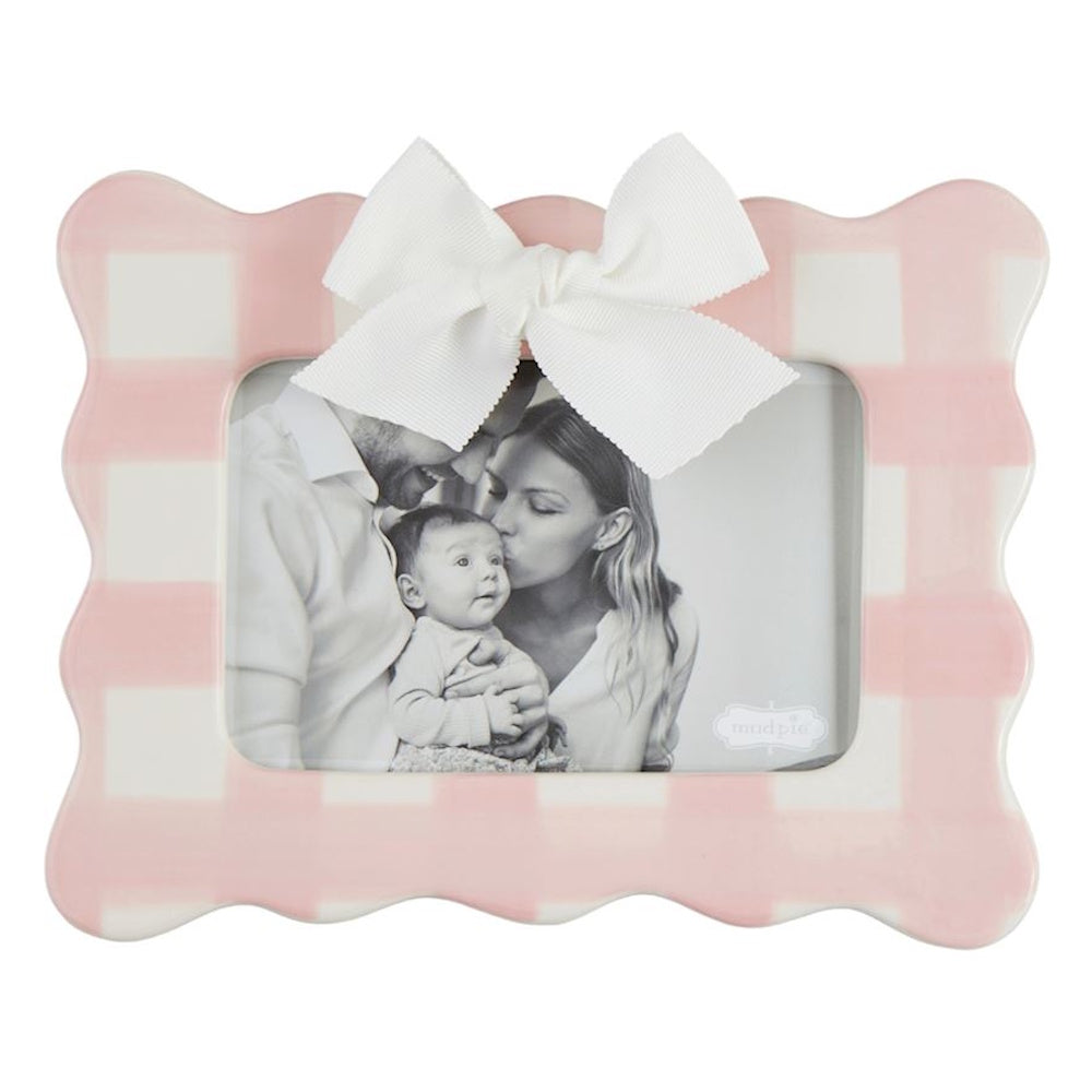 Pink and white gingham scalloped picture frame with a white bow, featuring a black and white family photo.