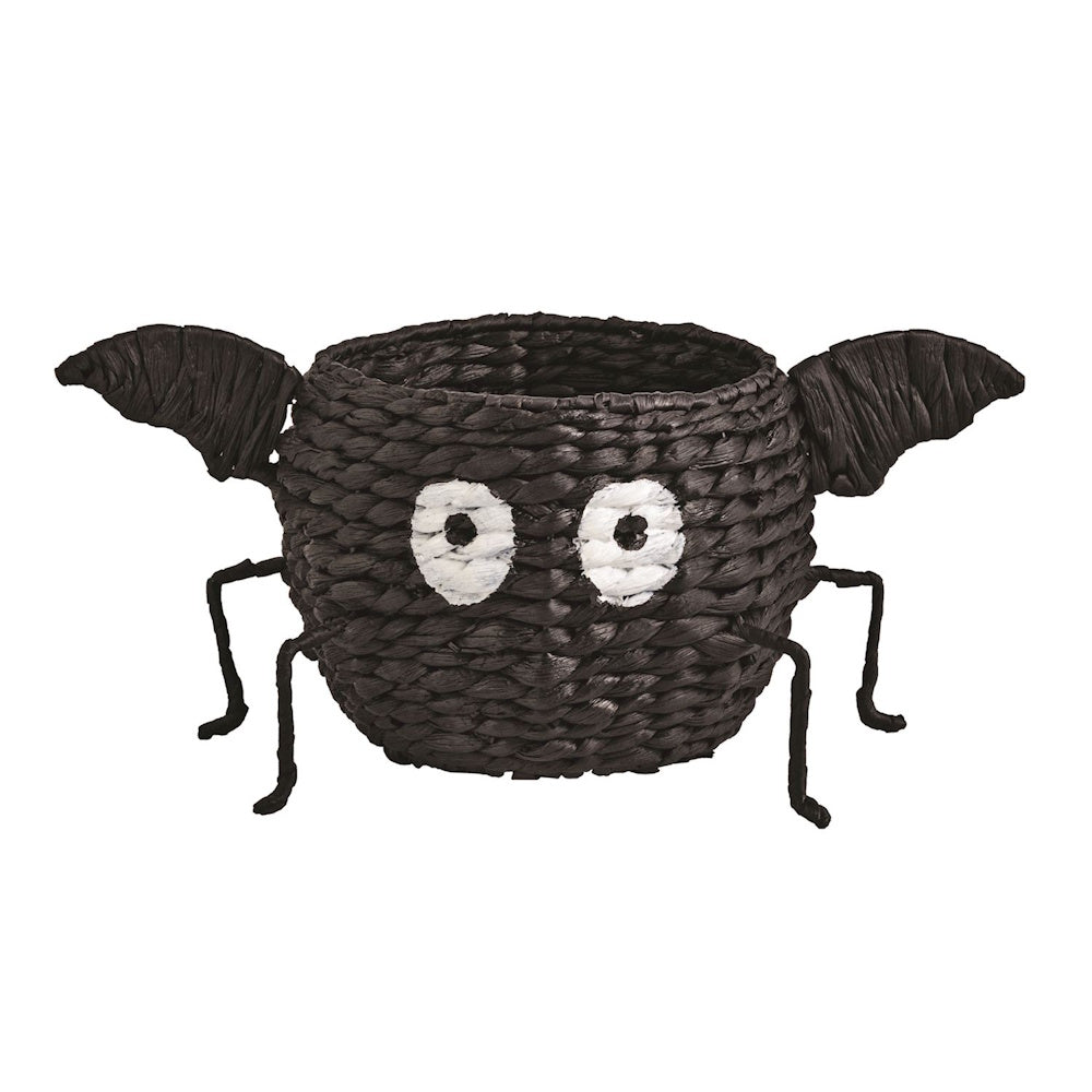 Woven black bat basket bowl with wings, googly eyes, and wire feet.