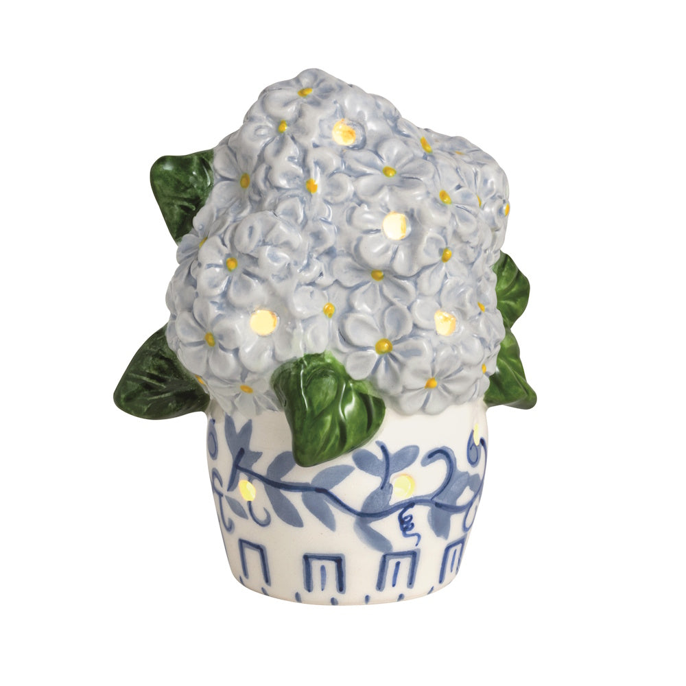 Ceramic light-up hydrangea sitter featuring blue flowers in a blue and white patterned pot with glowing cutouts.