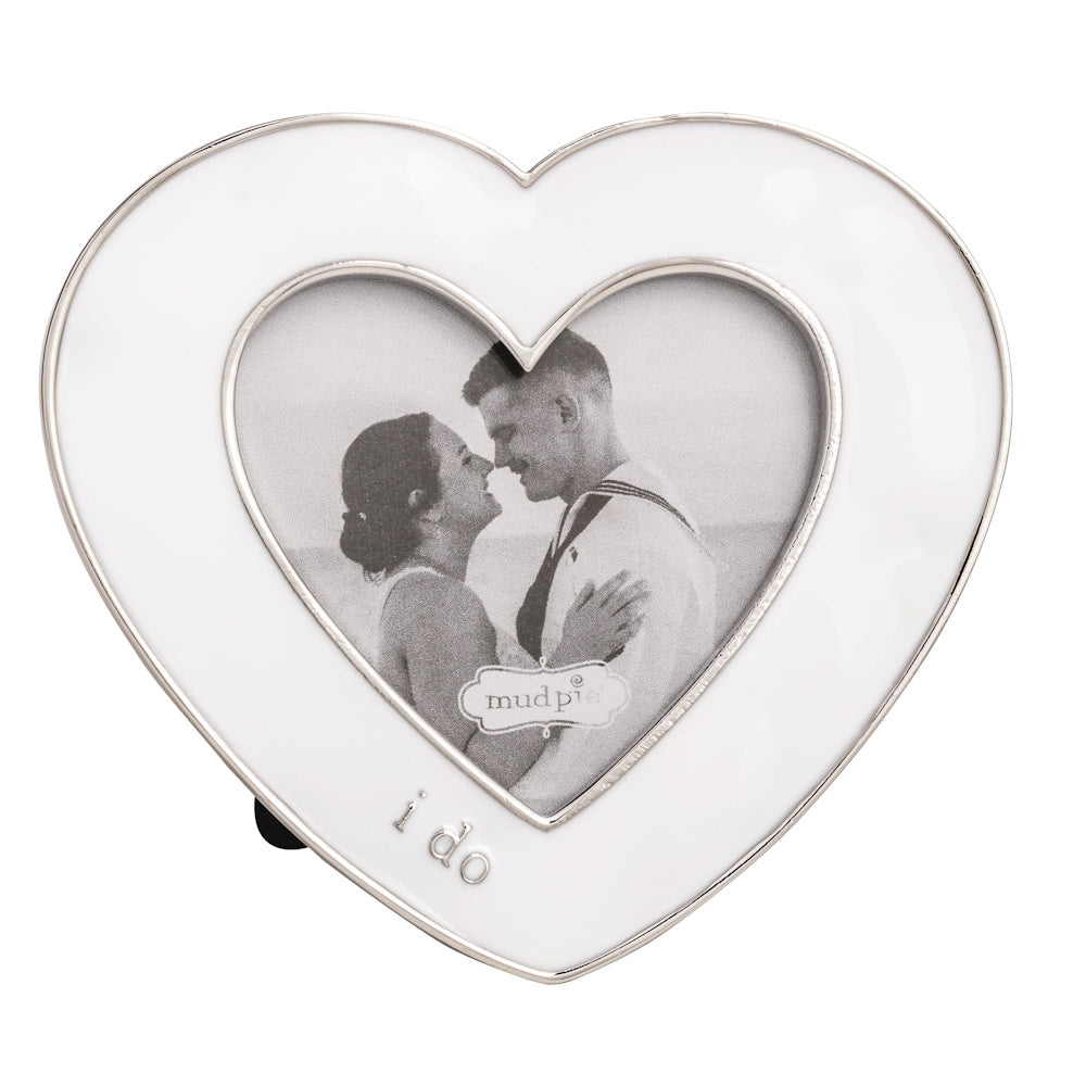 Heart-shaped white enamel photo frame with silver trim, featuring a black and white photo and the words "i do."