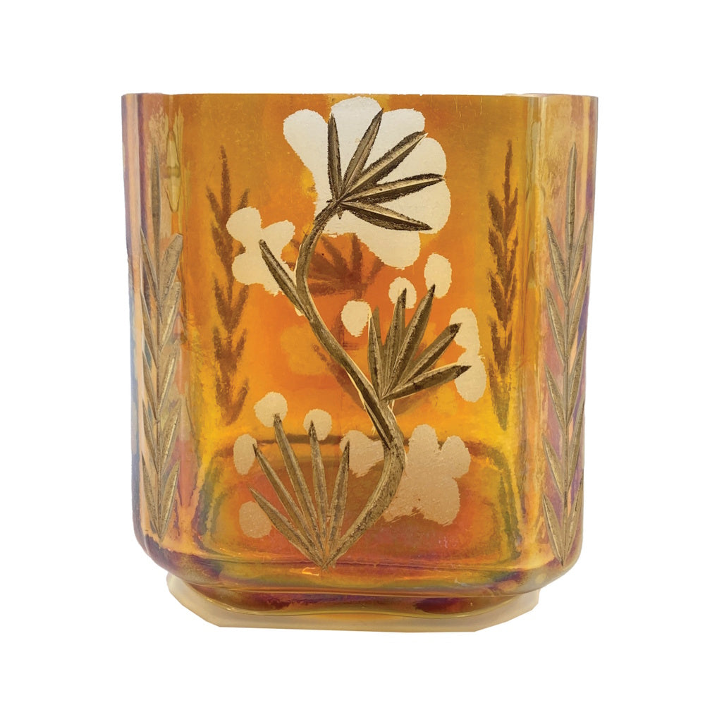 Iridescent amber glass votive holder featuring an etched floral pattern with white and gold details.