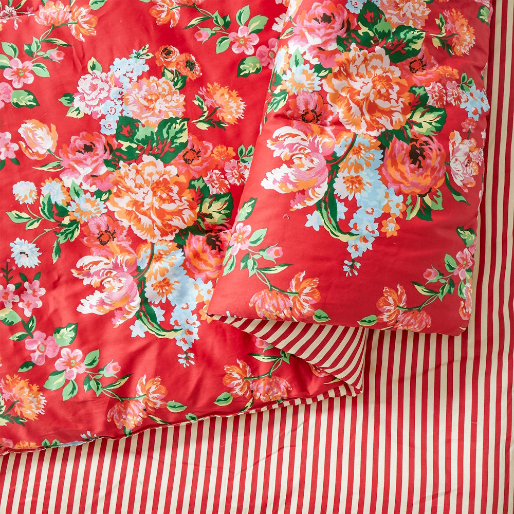 Junk Gypsy Garden Society red floral comforter with reversible red and white striped pattern close-up.