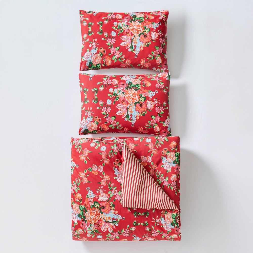 Red floral Junk Gypsy Garden Society comforter set with two matching pillow shams and a red-and-white striped reverse side.