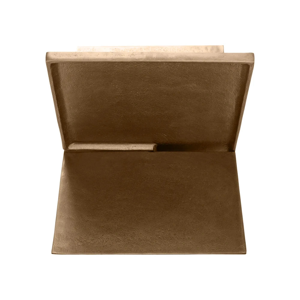 Bronze book holder shown from the side, appearing as an open book with textured, metallic pages.
