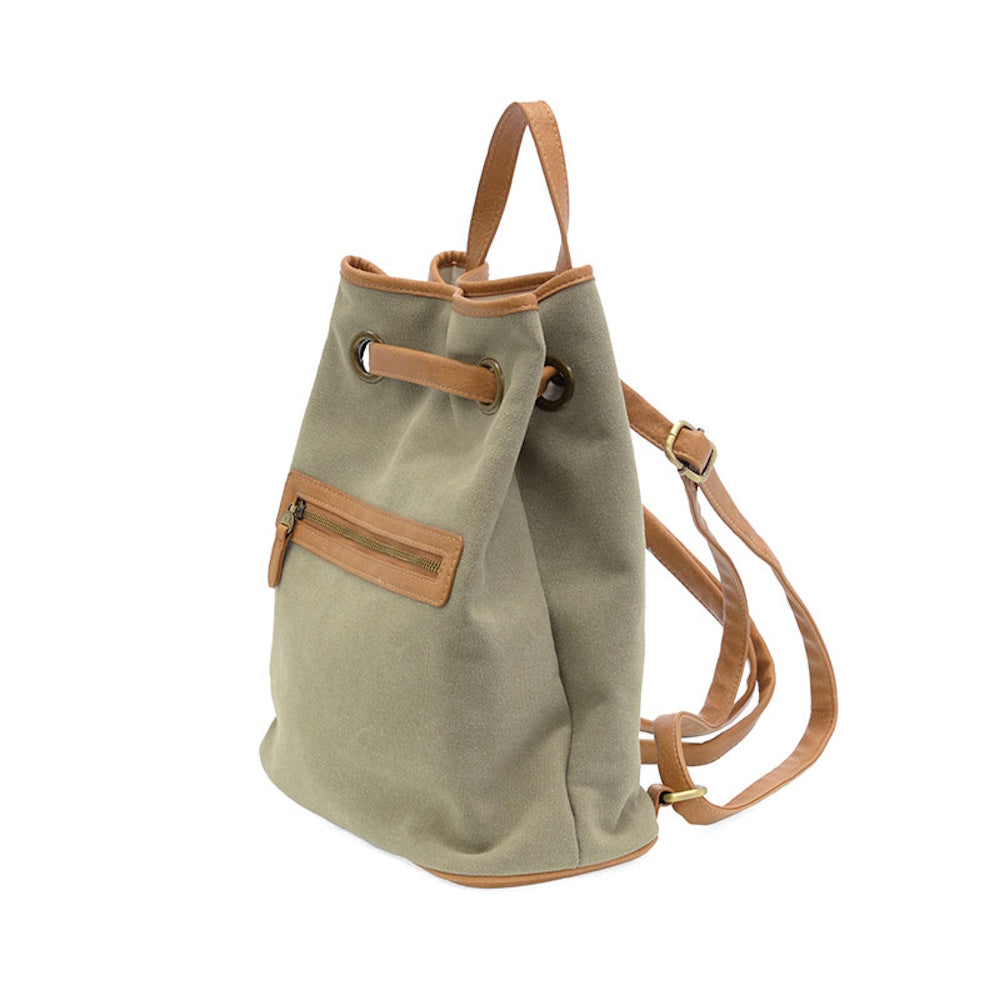 Khaki canvas drawstring backpack with tan leather trim, shoulder straps, and a front zippered pocket.