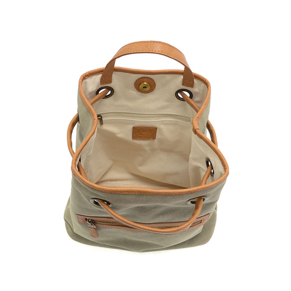 Top view of an open khaki canvas backpack with tan leather trim, drawstring closure, and white interior lining.