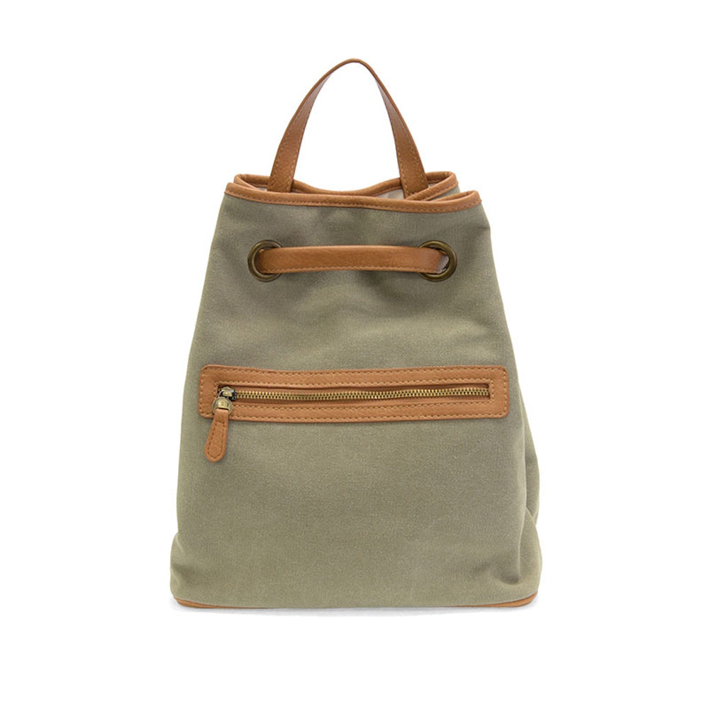 Khaki canvas backpack with tan leather trim, top handle, and a zippered front pocket on a white background.