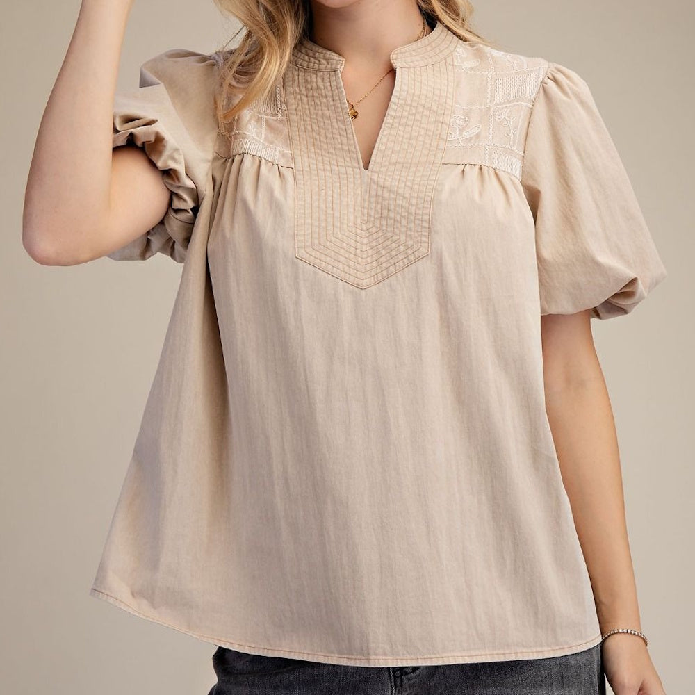 Tan puff sleeve blouse with V-neck embroidery and stitched yoke detail.