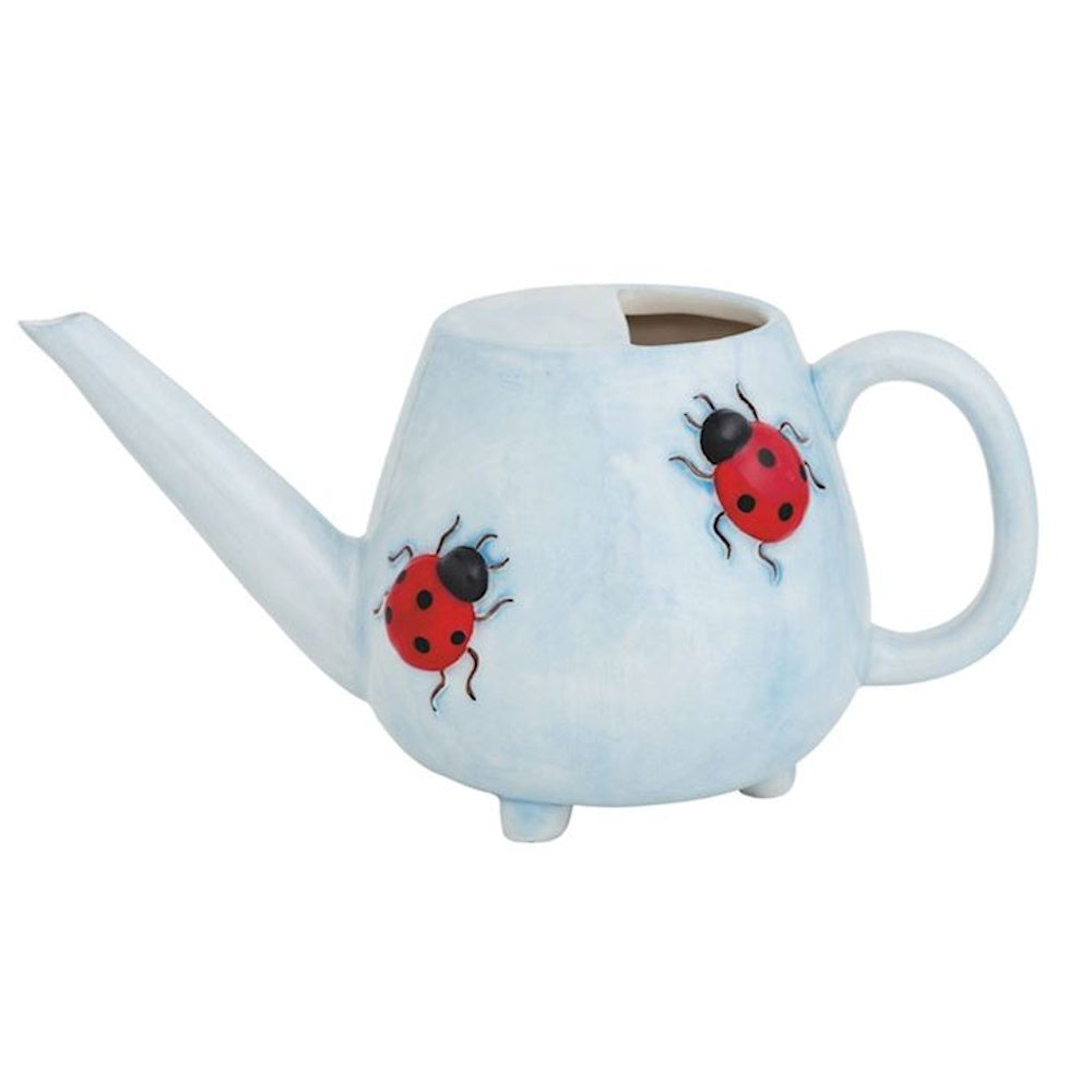 Small light blue ceramic ladybug watering can with a long spout, decorative handle, and three small feet on a white background.
