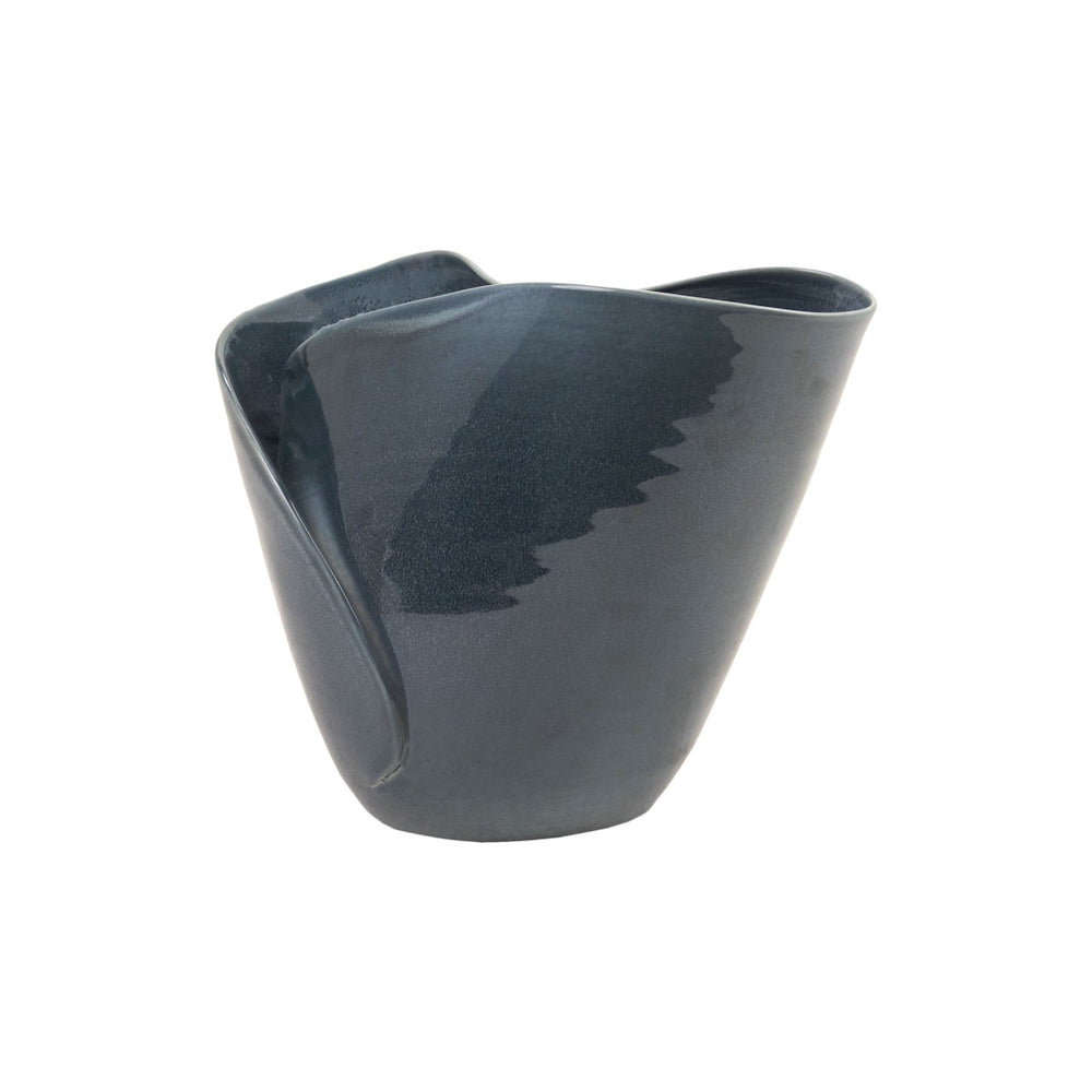 Dark blue ceramic Lamani bowl with an organic, wavy rim and glossy finish, viewed from the back on a white background.