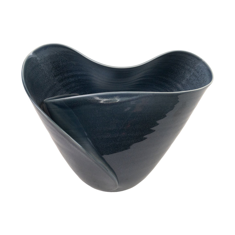 Side view of a dark grey ceramic bowl featuring a wavy, petal-shaped rim and speckled glaze on a white background.