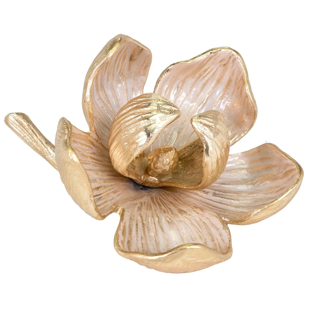Gold and pearl-enameled flower sculpture with layered petals and a textured stem on a white background.
