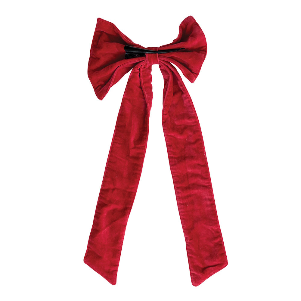 Large red cotton velvet hair bow with long trailing ribbons and a black clip on the back.