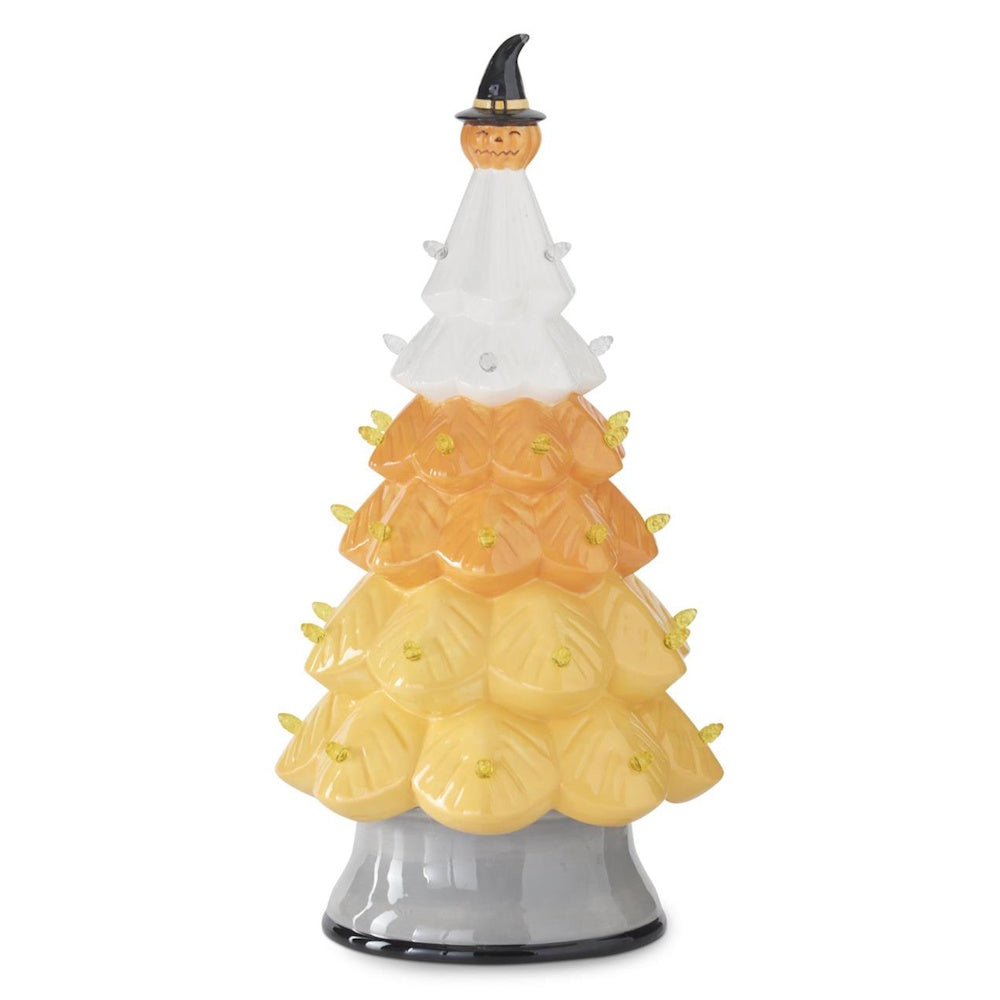 Ceramic candy corn Halloween tree with small lights, topped with a jack-o'-lantern wearing a witch hat.