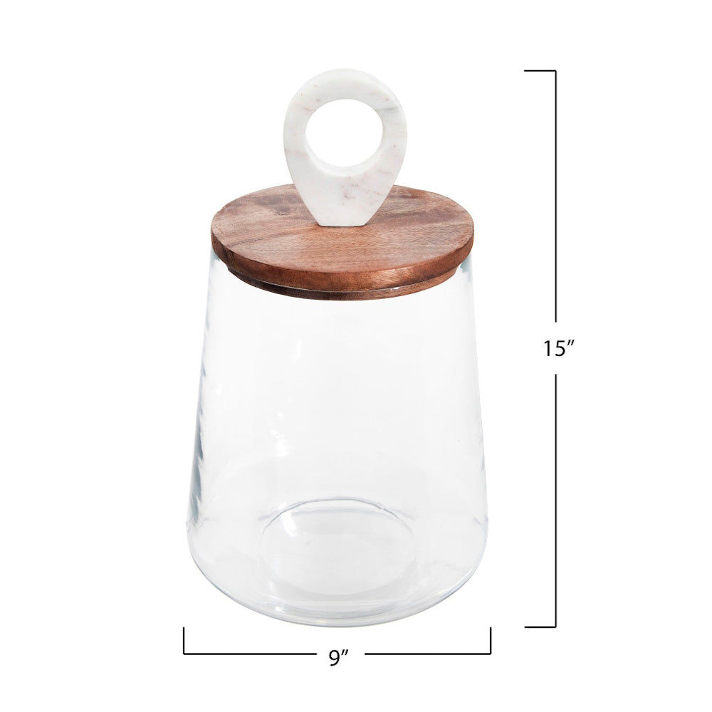 Clear glass jar with a wooden lid and marble ring handle, measuring 15" high and 9" wide.