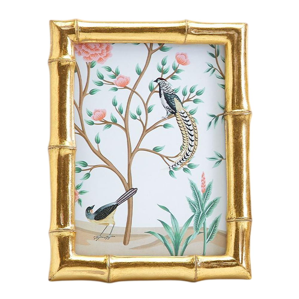 Front view of a large gold faux bamboo photo frame displaying botanical bird artwork.